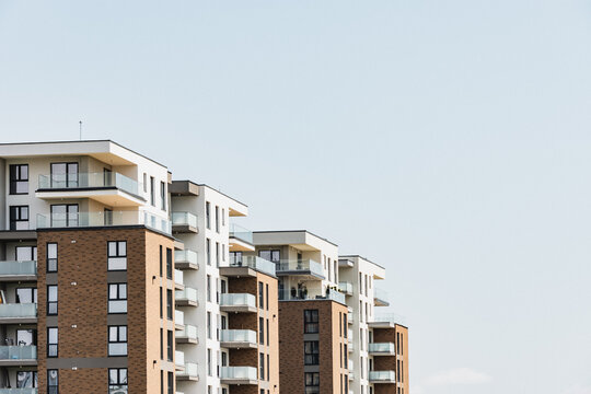 New apartment buildings with vintage colors, windows and balcony. Housing development in suburban area