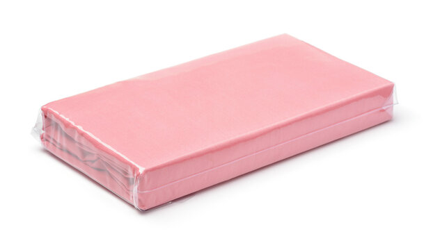 Folded pink cotton bedding sheets in clear plastic bag