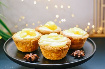 Baked pineapple cupcakes. Christmas lights with yellow cakes