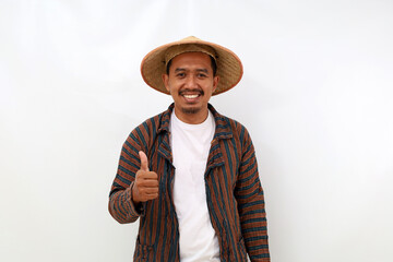 Happy asian farmer standing while showing thumbs up. Isolated on white background