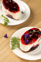 creamy dessert with berry jelly and violet flowers
