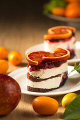 Delicious mousse dessert with red orange, close-up