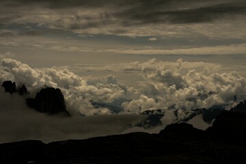 Gloomy cloudscape over Dolomite mountains, Italy