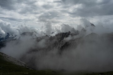 Clouds covering Dolomite mountains, Italy