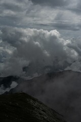 Dolomite mountains in dark gloomy clouds, Italy