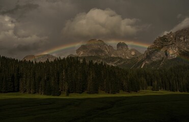 Rainbow over Dolomite mountains, Italy
