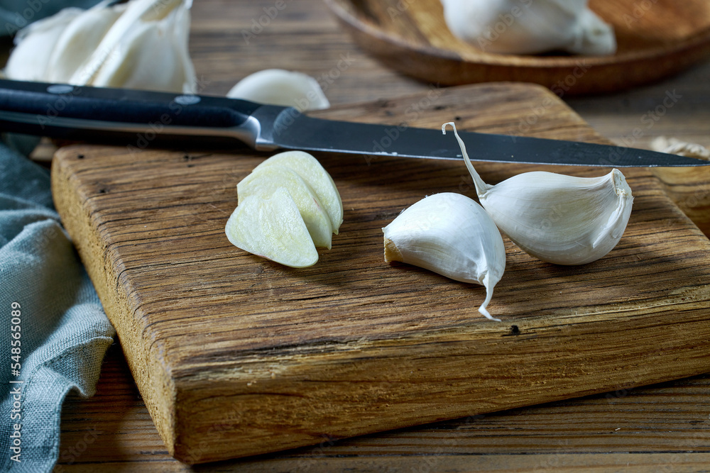 Poster fresh raw sliced garlic