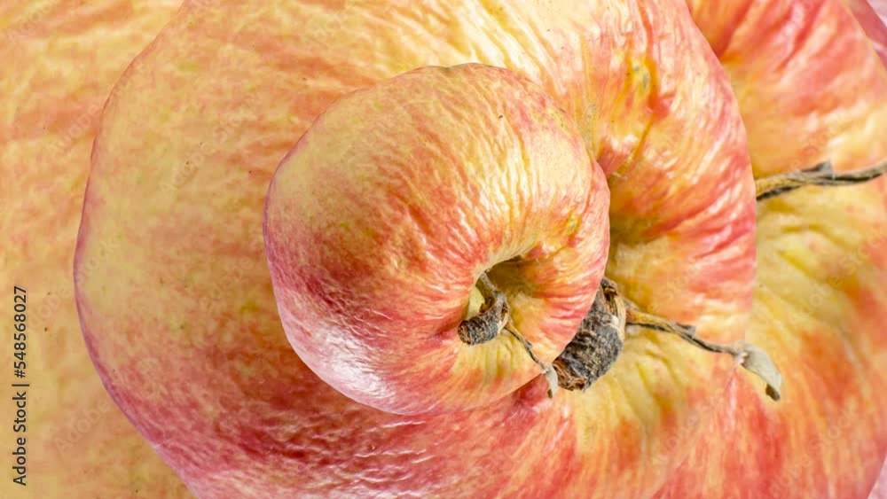 Poster rotting old red apple seamless loop zooming. abstract background with ugly fruit. aged food concept 