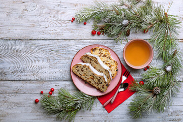 Christmas german Stollen pie on a light wooden table top view and place for text