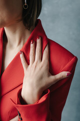 Woman's hand on a red jacket