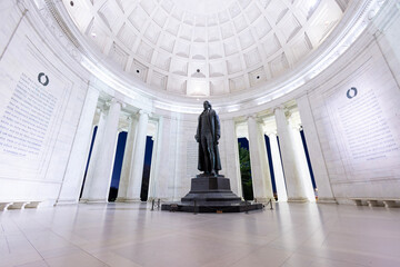 The interior of the Jefferson Memorial in Washington, D.C. on a winter evening. Ultra-wide low angle shot with no people visible.