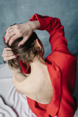 Open back woman in red suit
