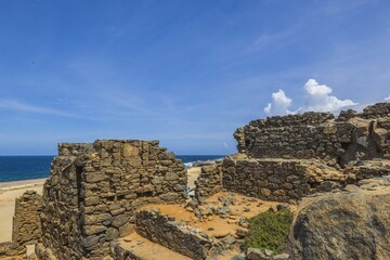 Fototapeta na wymiar Beautiful view from Bushiribana ruins high at blue water of Atlantic Ocean. Aruba.