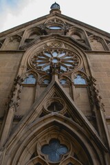 Low angle view of the Loretto Chapel in Santa Fe, New Mexico with elegant gothic arches and windows