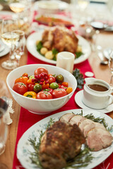 Christmas food, roast beef or tomato vegetables on dining table in empty house, home or restaurant. Zoom, texture and festive meat, ham or thanksgiving turkey in social gathering or lunch celebration