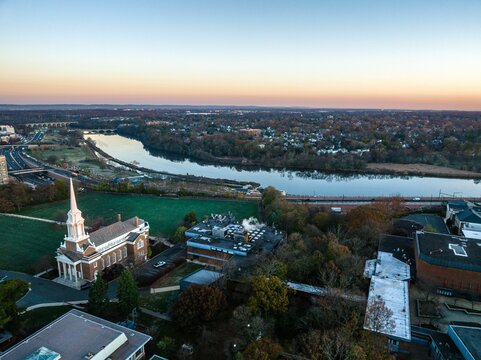 Drone view of a city skyline with buildings near the river in New Brunswick, Rutgers, Hub City, USA