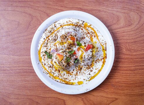 Spicy and sweet dahi baray or bhallay served in dish isolated on table top view of indian and pakistani food