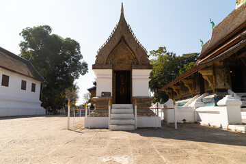 Buddhist building of traditional Lao architecture at Wat Xieng Thong temple in Luang Prabang, Laos