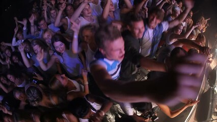 Crowd, dancing and DJ music festival for night party, audience or people enjoying disco event or concert. Diversity, community and energetic dance party at festival, rave or techno music outdoors