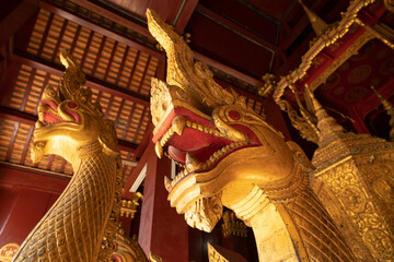 Ancient religious ceremonial barge, with golden representations of fearsome snake-like Nagas,...