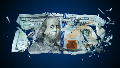 Broken banknote US paper money on a blue background - obrazy, fototapety, plakaty