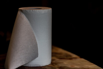 one roll of paper towels  on table standing vertical