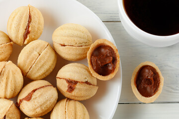 Traditional breakfast with homemade cookies. nuts with condensed milk