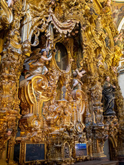 Fototapeta na wymiar Iglesia de San Luis de los Franceses, Capilla Doméstica by Duque Cornejo, altarpiece gold carving detail