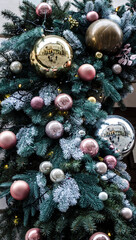 Christmas balls of on a blurred background, decorated with a silver branch.