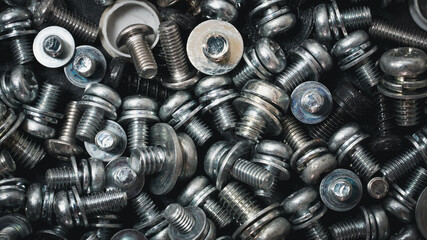 Metal nut screw or iron nut screw nails stack used in industrial building background texture.