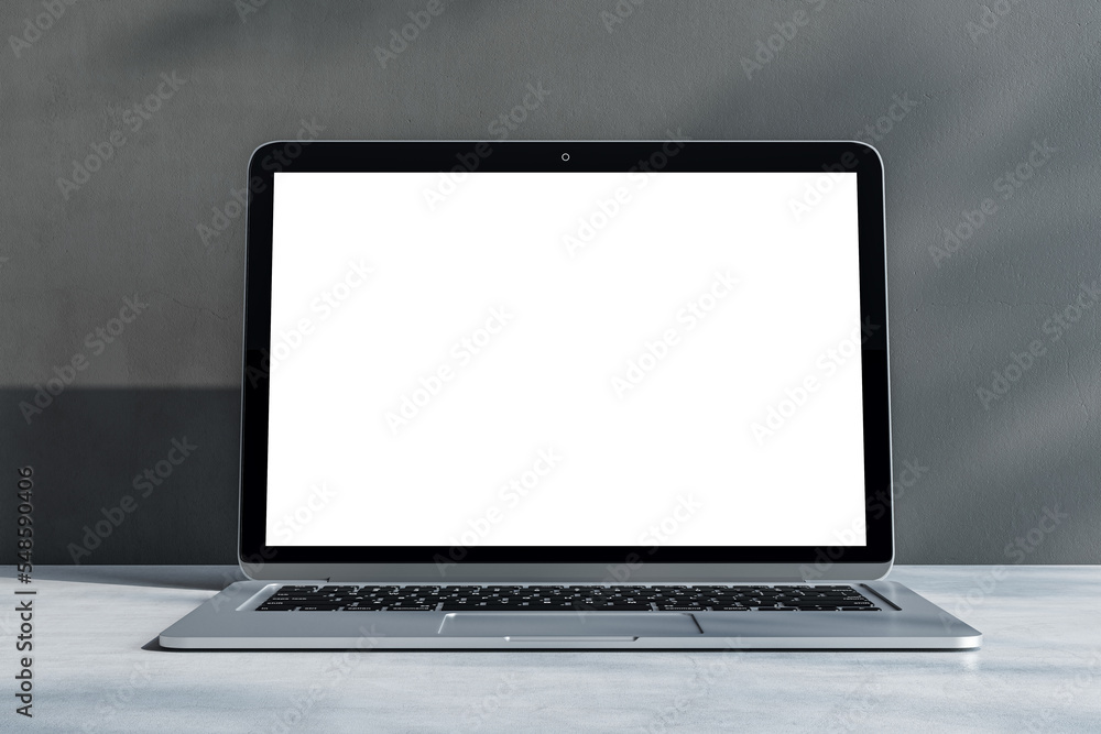 Poster front view on blank white laptop monitor with place for your logo or text on light grey concrete sur