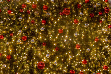 Season greeting theme concept, Selective focus of multi color balls hanging on Christmas tree,...