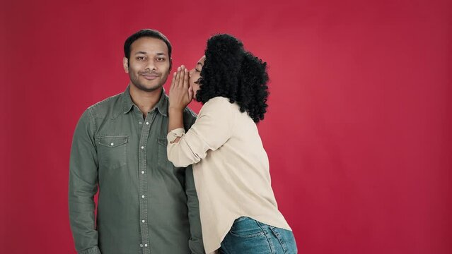 Woman tells secret and Indian man closes mouth on lock
