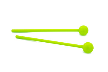 Toy colorful drumsticks isolated on the white background