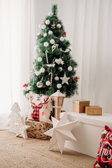 beautiful Christmas decoration at home, christmas tree, gifts and ornaments