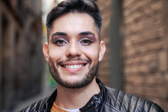 Gay transgender person wearing makeup smiling outdoor - LGBTQ nonbinary concept