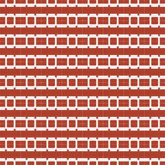 Symmetrical perforated white puzzle shape tiles on a red background