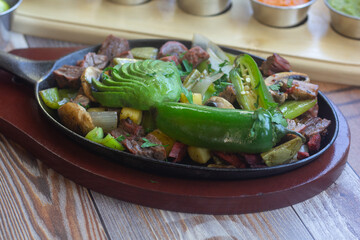 Carne asada plate with mexican food and sauces