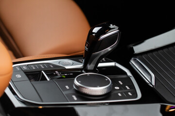 Modern automatic gearbox. Close up of the gearbox transmission handle. Automatic gear stick.