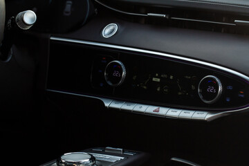 Car air conditioner dashboard. Modern car interior. Adjustable air conditioner. Car air conditioning system.