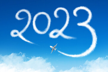 Happy New year 2023 concept travel on the blue background below cloudscape. Drawing by passenger airplane vapor steam contrail in sky. - obrazy, fototapety, plakaty