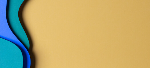 Abstract colored paper texture background. Minimal paper cut style composition with layers of...