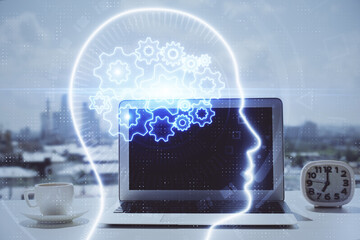 Double exposure of desktop with computer and brain drawing hologram. Artificial intelligence...