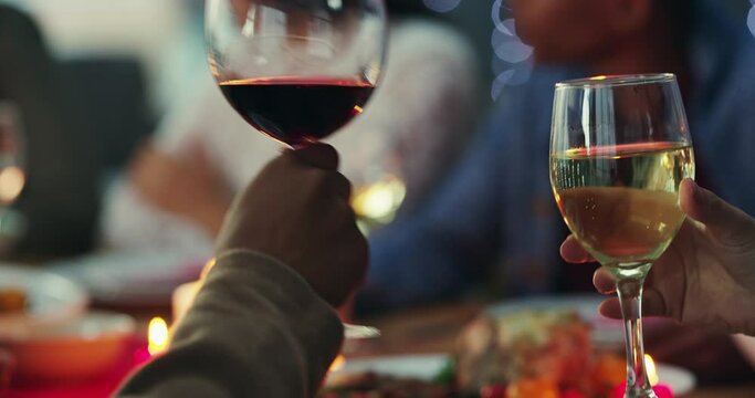 Friends hands, wine toast and dinner party, celebration and drink together at event, social and candles with bokeh. People hand, alcohol drink and cheers to celebrate with glasses and dining room