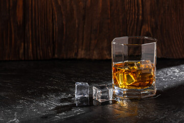 Whiskey with Ice on a Wooden Table