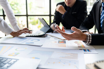 Meeting concept Business team hands at working with financial plan, meeting, discussion, brainstorm with tablet on the office desk