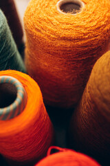 Composition of colorful vibrant wool threads from above.