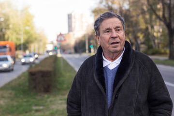 Pensive senior man cross the street