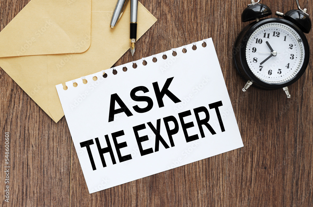 Poster ask an expert concept. text on paper on an envelope on the desktop