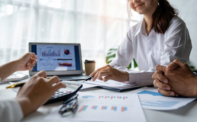 business people meeting in the office Calculate the tax and income of the company's investment. Strategic Planning and Brainstorming colleague concept, report, analyze graph plans